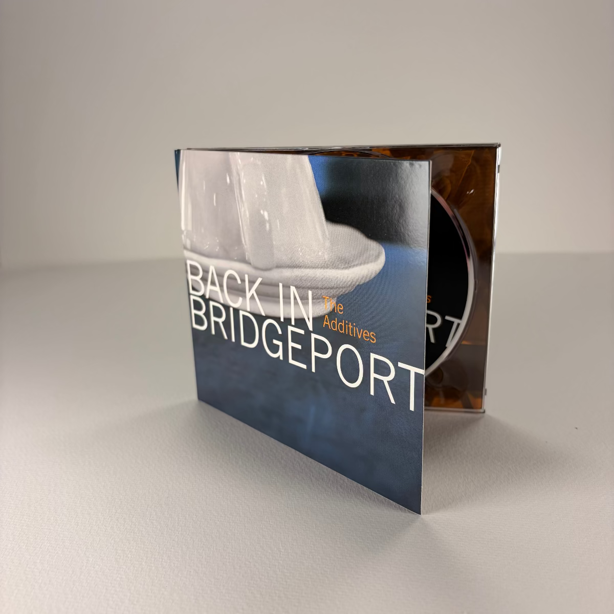 Product packaging with 'Back in Bridgeport' text on a neutral background